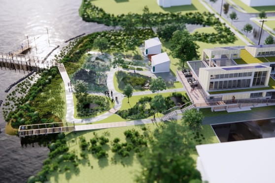 An aerial rendering of a modern building with many walkways and sidewalks around it that connect to a boardwalk.