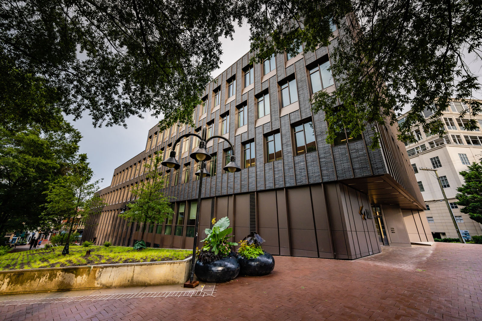 A modern building with a brick and glass facade.