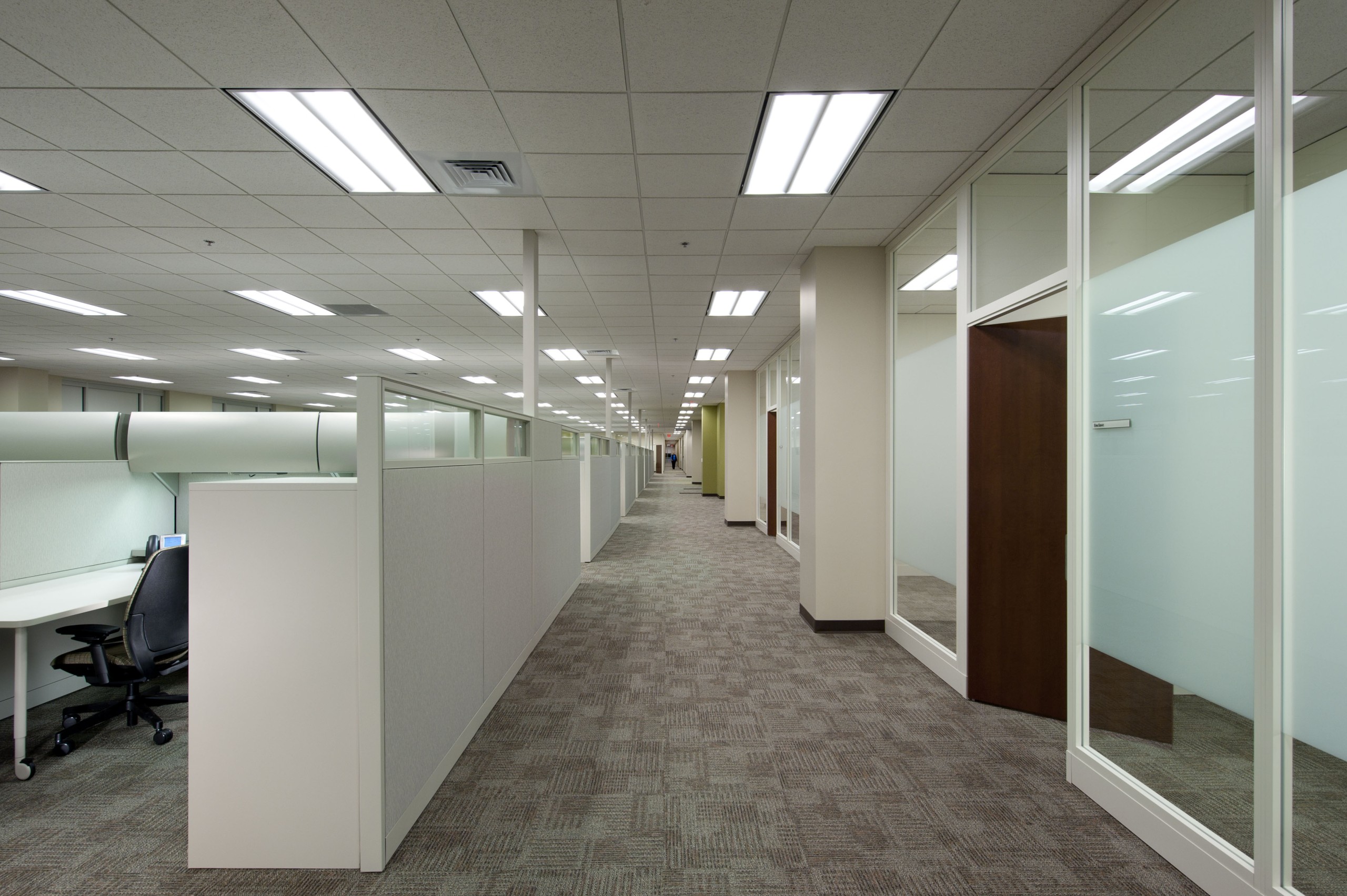 Interior office with cubicles and hallway