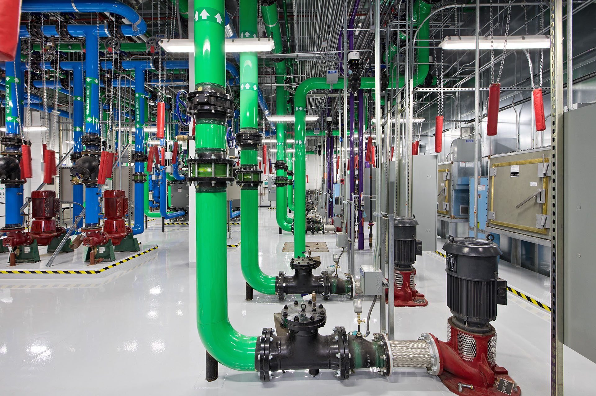 Green pipes in interior of data center