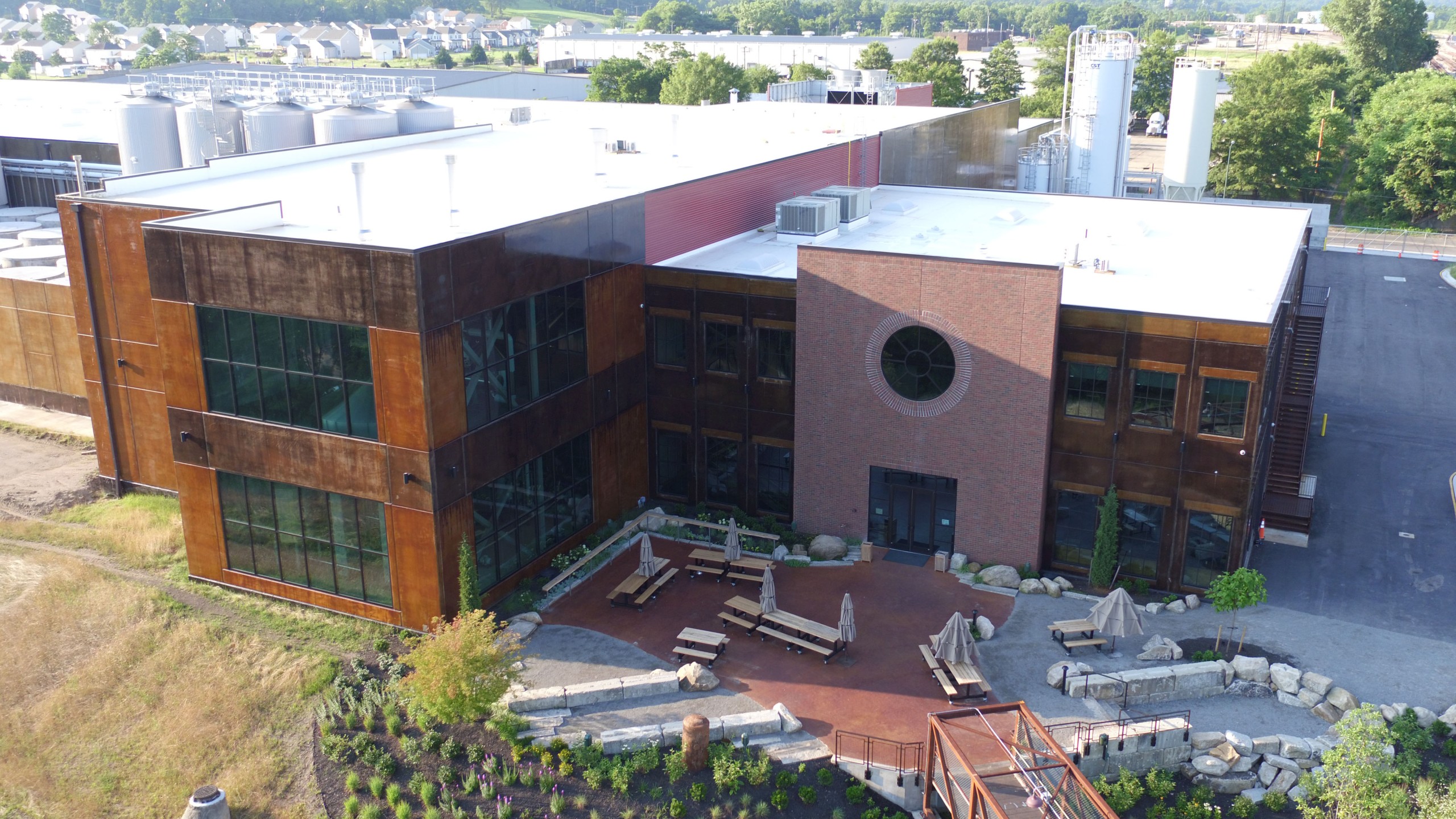 Aerial image of two story brick brewing facility