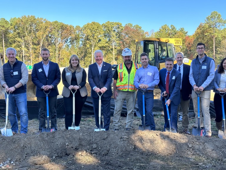 10 people holding ceremonial shovels at site kickoff